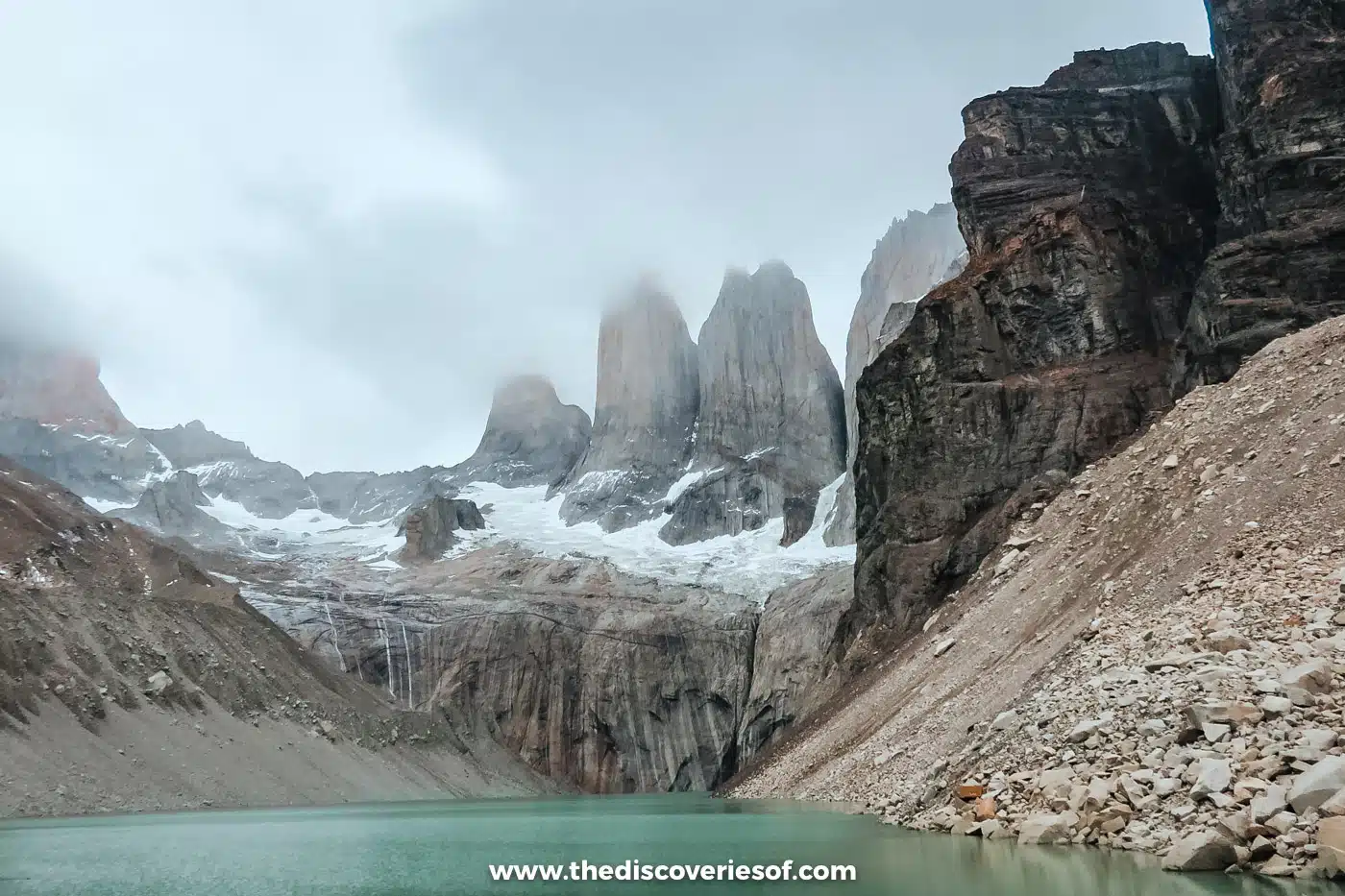 Mirador Base Torres lagoon below the cloud-wrapped towers, Torres del Paine, Chile