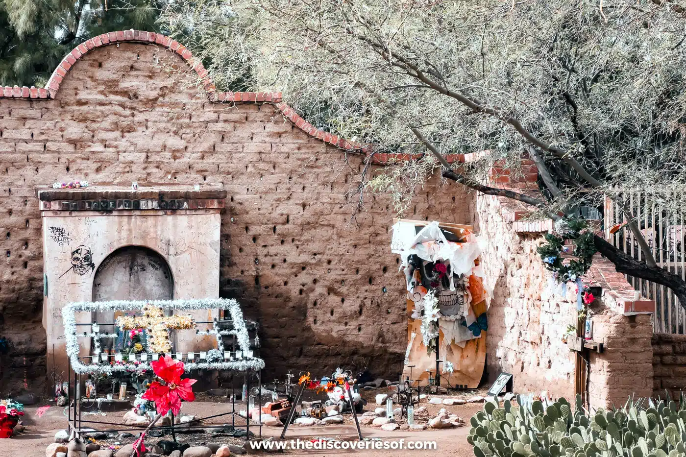 Candles, flowers and offerings at the crumbling adobe El Tiradito wishing shrine in Barrio Viejo, Tucson