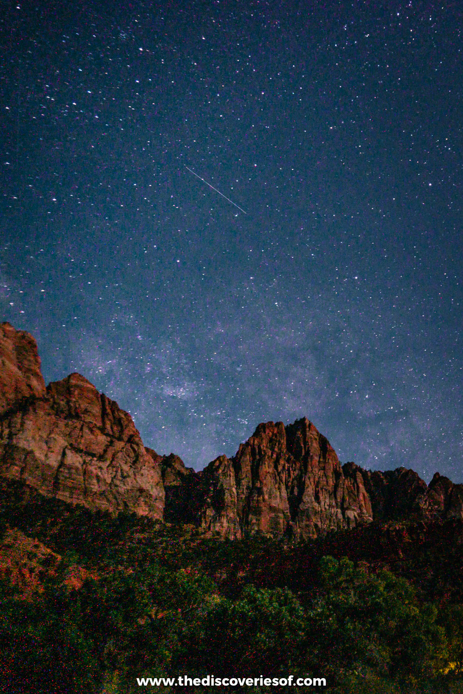The Milky Way over the cliffs of Zion National Park at night